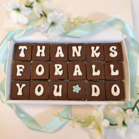 18 solid chocolate square spell out thanks for all you do in fondant letters and flower