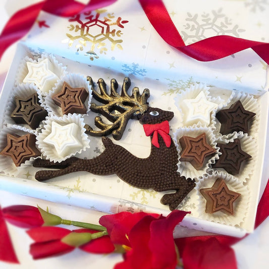 Beautiful reindeer shaped chocolate surround by chocolate stars